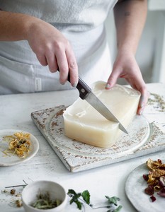 Start by chopping up your soap base into small chunks or grate it to make it melt faster. Prepare your moulds by very lightly oiling. Organise the colours you want to use and decide on the combinations of herbs, flowers and aromas prior to melting.